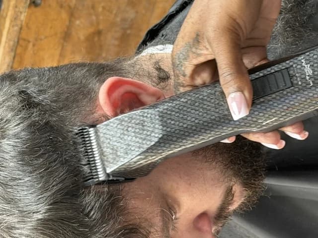 Clippers detailing the side of a client's cut at Barber Shack in Bellingham.