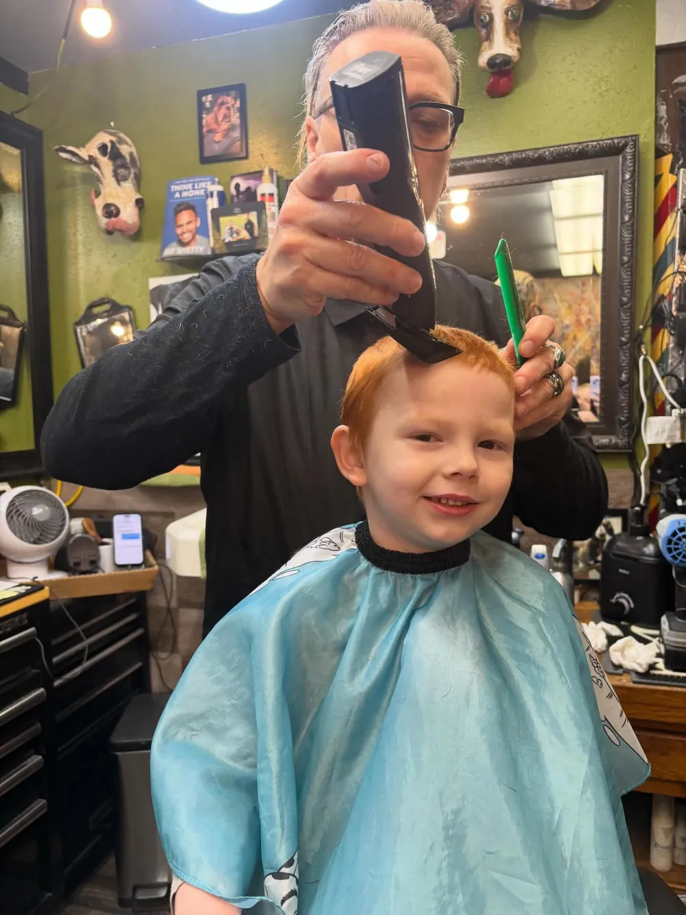A young client getting a back-to-school cut at Barber Shack.