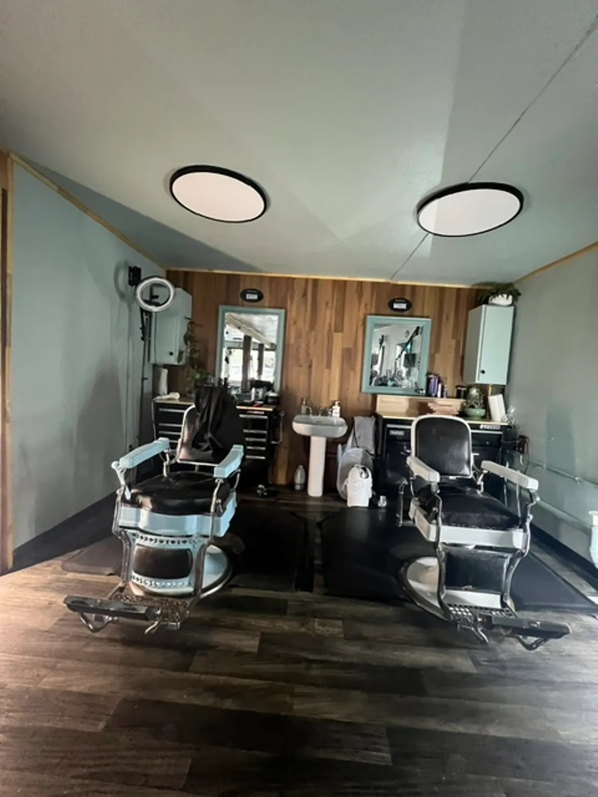 Another look inside Barber Shack — chairs and stations along the shop floor.
